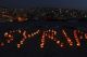 Syrian and local children in  Amman, Jordan, highlight the plight of those suffering in Syria the night before the second anniversary of the start of the conflict  (Reuters)