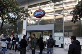 People walk outside a state employment agency OAED office in Athens (Photo: Reuters)
