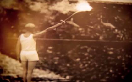 The video contains a clip from the torch relay of the 1936 Berlin Olympics
